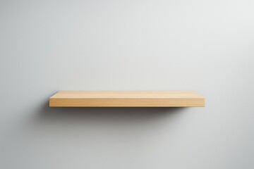 Wall Mural - Minimal wooden shelf hanging on clean white wall with soft light shadow creating modern background for creative product display concepts.