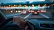© Curioso.Photography - Driver's hand on steering wheel approaching toll booth in traffic at sunset.