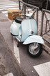 Classic blue scooter on the street - vintage transport