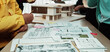 © InfiniteFlow - Engaging architecture studio scene showing diverse hands sketching blueprints, discussing innovative designs, and showcasing a model for a construction project. SACTR