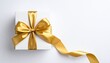 © ruangrit19 - Elegant White Gift Box with Gold Ribbon Bow Perfect for Occasions.