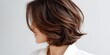 © inspiretta - Woman with brown hair and a white shirt