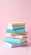 © Shalwaotavini - Stack of Books on Pink Background