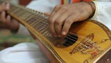 Close-up of hands playing a string instrument
