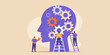 © John Lee - Team of people working together to build and repair gears inside a human head silhouette symbolizing teamwork and problem solving