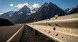 © Oxiya - Mountain Road with Guardrail and Snow Capped Peaks.