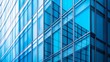 © Yultoms95 - Fragment of a modern office building. Abstract geometric background. Part of the facade of a skyscraper with glass windows.