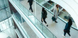 © Jacob Lund - Businesspeople walking through modern office building interior