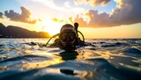 Diver enjoying sunset underwater