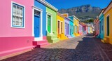 Vibrant bokaap street with colorful houses and table mountain in cape town