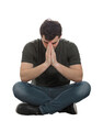 © 1STunningART - Stressed man sitting with hands folded together praying and thinking. Desperate male full length seated portrait isolated on transparent background