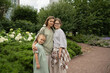 © ADDICTIVE STOCK - Mom and daughters enjoying a day in the city garden