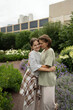 © ADDICTIVE STOCK - Mother and daughter sharing a tender city moment