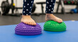 © MUHAMMAD - Little one's feet engaging with tactile balance pods, fostering motor skills and sensory integration
