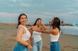 © Bohdan - Young women enjoying fun moment on beach