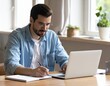 © aziz - Young Brazilian Professional Focused on Online Learning at Home Office
