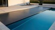 © phj.domingos - Modern swimming pool with a closed automatic safety cover at sunset photos of swimming pools, houses with swimming pools, people in swimming pools