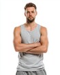 © pixs4u - Confident young man in a tank top strikes a strong pose, showcasing fitness and determination against a white backdrop.