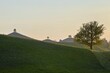 © Stefan Huwiler/imageBROKER - Moraine landscape at sunset, with lime trees (Tilia) on a hill, Hirzel, Canton Zurich, Switzerland