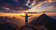 © STwul - Woman with outstretched arms on mountain peak at sunset, celebrating freedom and success.
