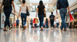 © Shri - People shopping in a bright, modern mall with shopping bags and reflections on the floor