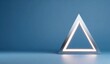 © tan - Geometric, illuminated triangle on a blue surface