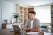 © Migma_Agency - Freelancer working from home having a video call on laptop