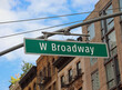 new york city intersection with large W Broadway street sign