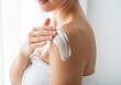 © Ngoc - Woman Applying Body Lotion on Shoulder – Skincare Concept