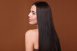 © New Africa - Woman with beautiful smooth hair after lamination procedure on brown background