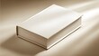 © suprato - A pristine white book lies on a neutral backdrop, highlighting its clean lines and simple elegance.