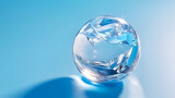 Glass globe melting ice climate concept sustainability blue background minimal design reflective surface environmental theme crystal sphere clean light evokes concern for planet and hope for change