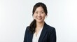 © awik - Professional Asian Woman Smiling in Business Attire