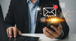 © motion-max - Modern professional using smartphone for digital communication and email notifications