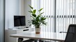 © SM - Modern office corner with clean-lined furniture and potted plant, natural light through vertical blinds.