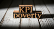 © Anita - Key Performance Indicators KPI poverty concept with vintage wooden letter blocks on rustic surface