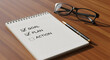 © Anita - Achieve success with checked goal and plan, ready for action on notepad with pen and glasses