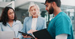 © peopleimages.com - Communication, hospital management or surgeon with tech, policy development or strategy for quality service. Serious, talk or people in hallway meeting, care standard or budget for healthcare plan