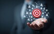 © Mandiri - Businessman holding a target in the middle of a cloud of people