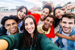 © Xavier Lorenzo - Young group of diverse student friends taking selfie portrait with phone outside. Friendship lifestyle and youth community concept