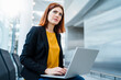 © Westend61 - Thoughtful businesswoman with laptop on chair