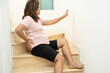 © amazing studio - Asian lady fall down the stairs and pain at hip and waist because slippery surfaces.