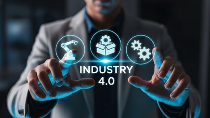 Man using holographic display with icons of glowing industry 4.0 and text, smart factory and robotics automation