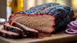 © SY DesignHouse-2 - Juicy smoked beef brisket sliced and ready to serve with red onions on a wooden board culinary delight