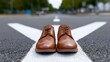 A pair of classic brown leather Oxford shoes positioned on a pedestrian crosswalk in an urban setting, symbolizing business, fashion, and daily commutes.