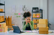 © Parichat - Young african american woman running a small business feeling pensive at her desk