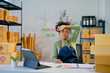 © Parichat - Young overworked entrepreneur feeling stressed while managing her online store