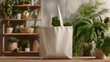 © Momin Photo Gallery - Elegant photo of stylish beige canvas tote bag mockup template on wooden table in art studio. Eco friendly totebag made of natural cotton. Reusable shopper ecobag mock up.