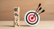 © Hiro's design - Business strategy success concept with targets arrows and gear icons on wooden blocks symbolizing goals and workflow