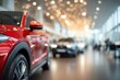 © Marina Demidiuk - Car dealer blur background with red new car on the foreground. Cars showroom defocused backdrop. Blurred abstract dealership store, with defocused cars, staff with soft lightning. Dealership auto
